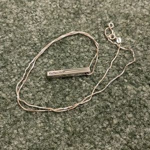 Silver bar necklace says Reflection
